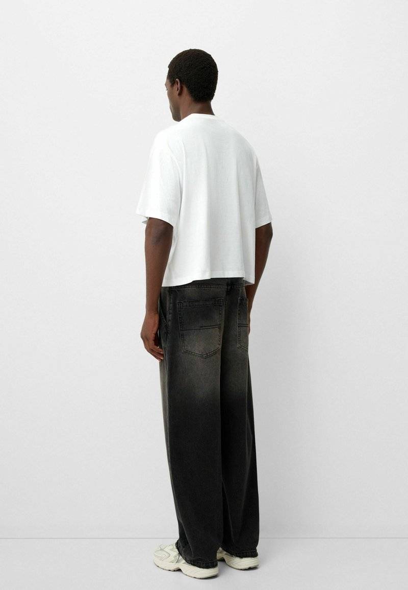 Bershka Bershka Relaxed fit jeans - black denim im Angebot