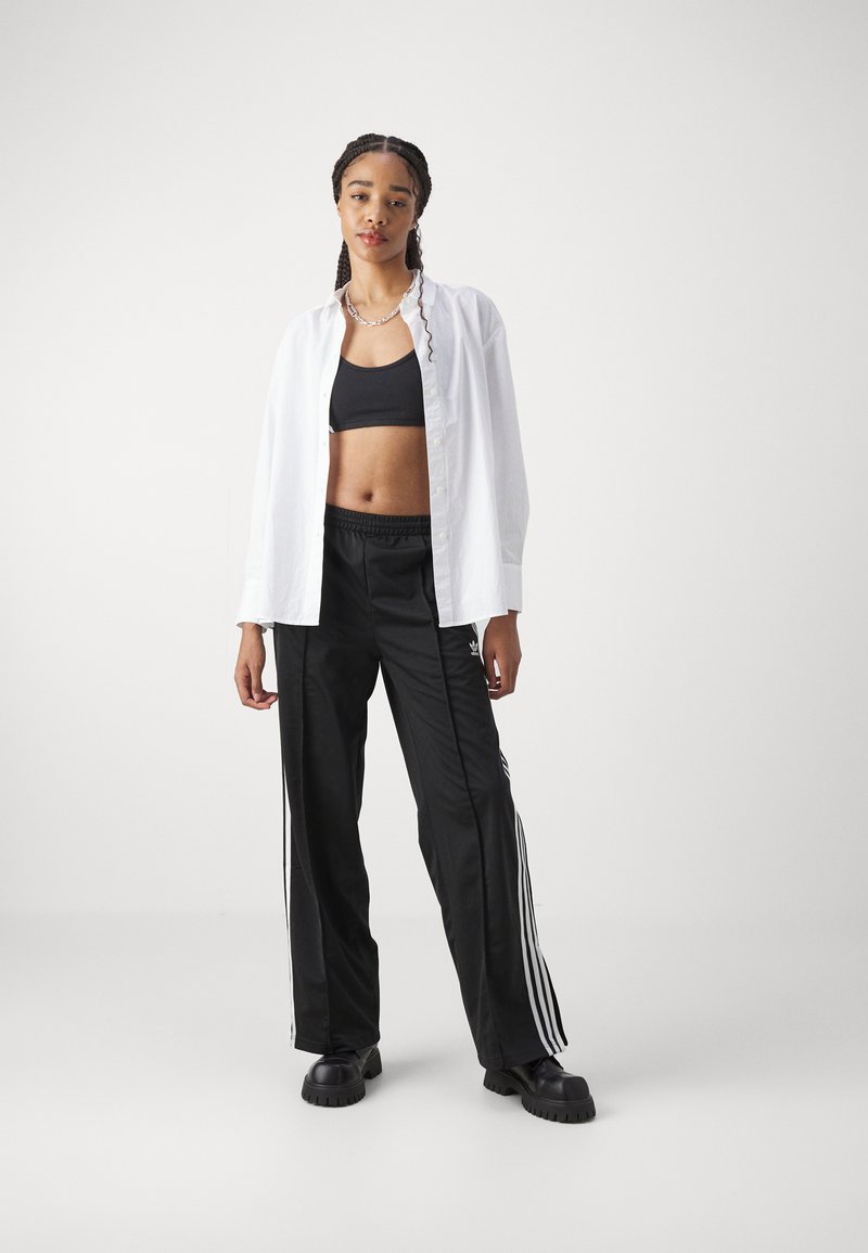 adidas Originals adidas Originals FBIRD LOOSE - Tracksuit bottoms - black Meist gekauft