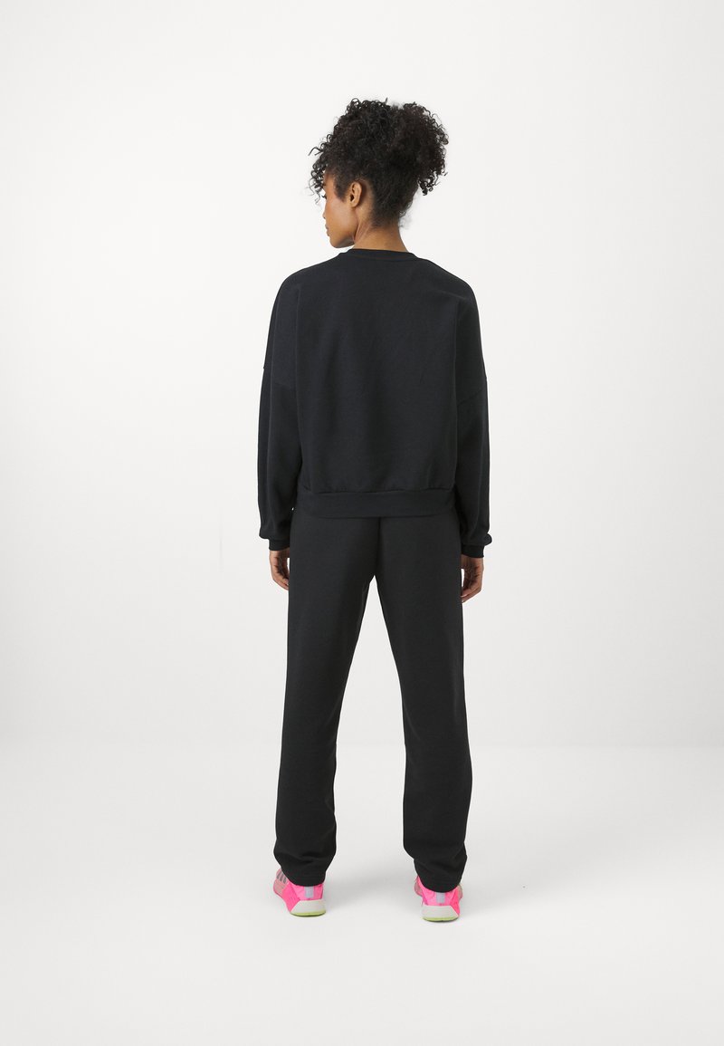 adidas Sportswear adidas Sportswear ESSENTIALS SMALL LOGO FEEL COZY OPEN HEM PANT - Tracksuit bottoms - black Hotsell