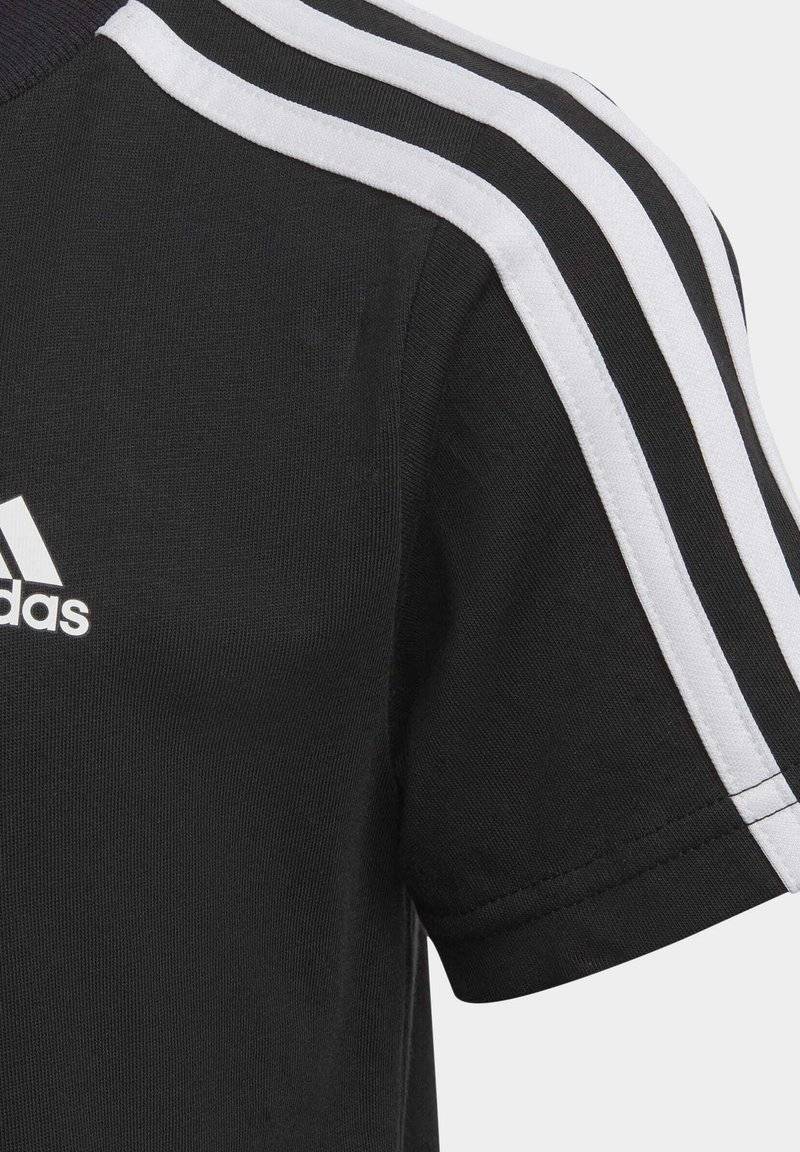 adidas Performance adidas Performance TEE UNISEX - Print T-shirt - black white 2025