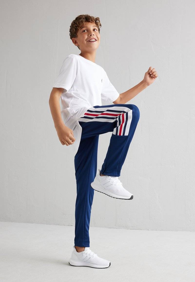 adidas Performance adidas Performance TIRO NATIONS PACK UNISEX - Tracksuit bottoms Osterangebot