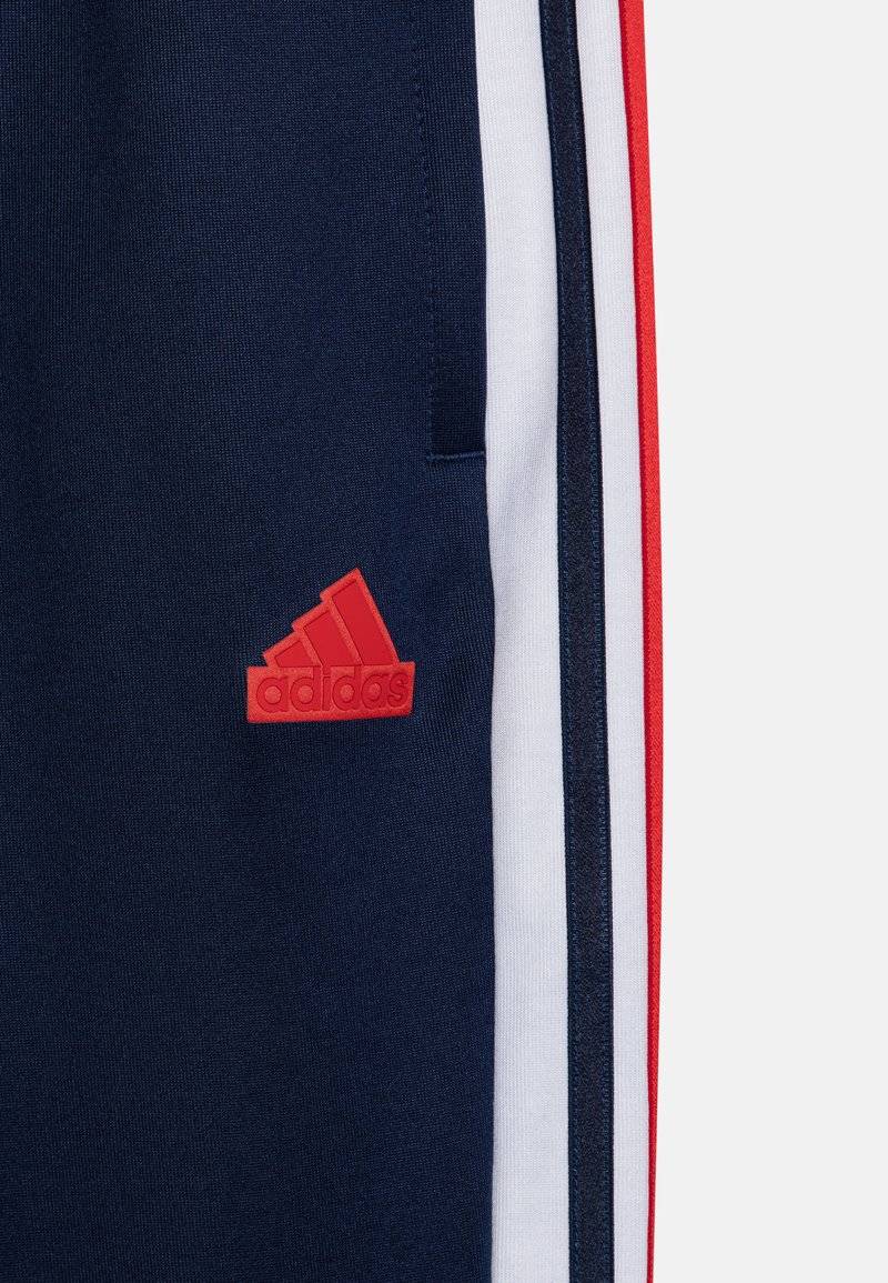 adidas Performance adidas Performance TIRO NATIONS PACK UNISEX - Tracksuit bottoms Osterangebot