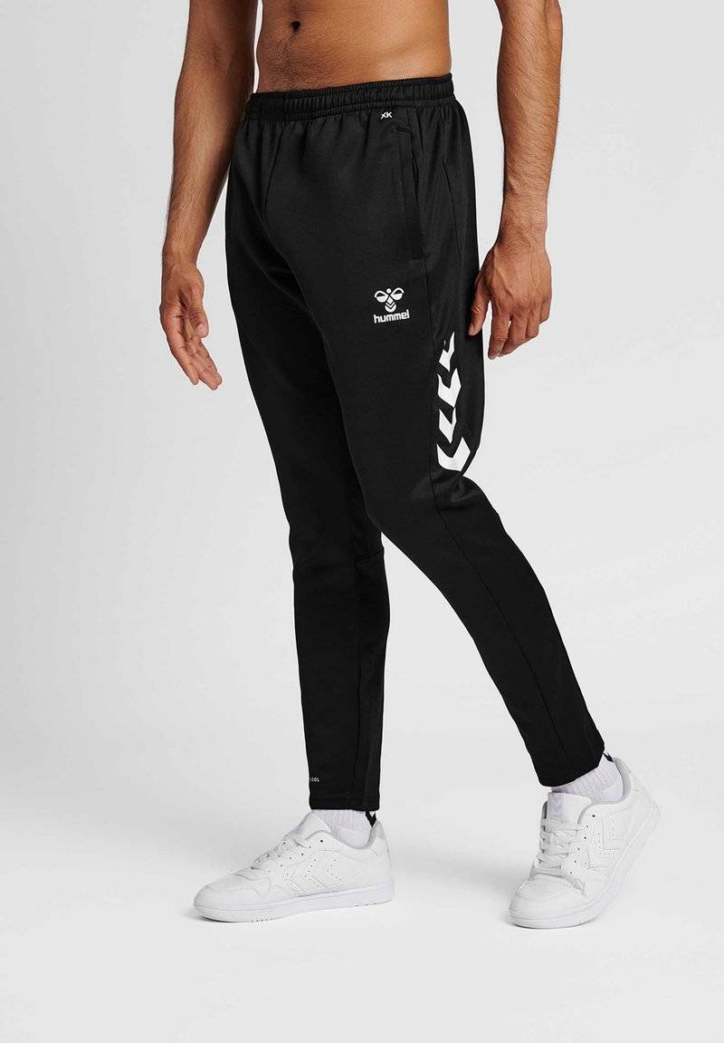 Hummel Hummel CORE XR TRAINING PANTS - Tracksuit bottoms - black Lagerräumung