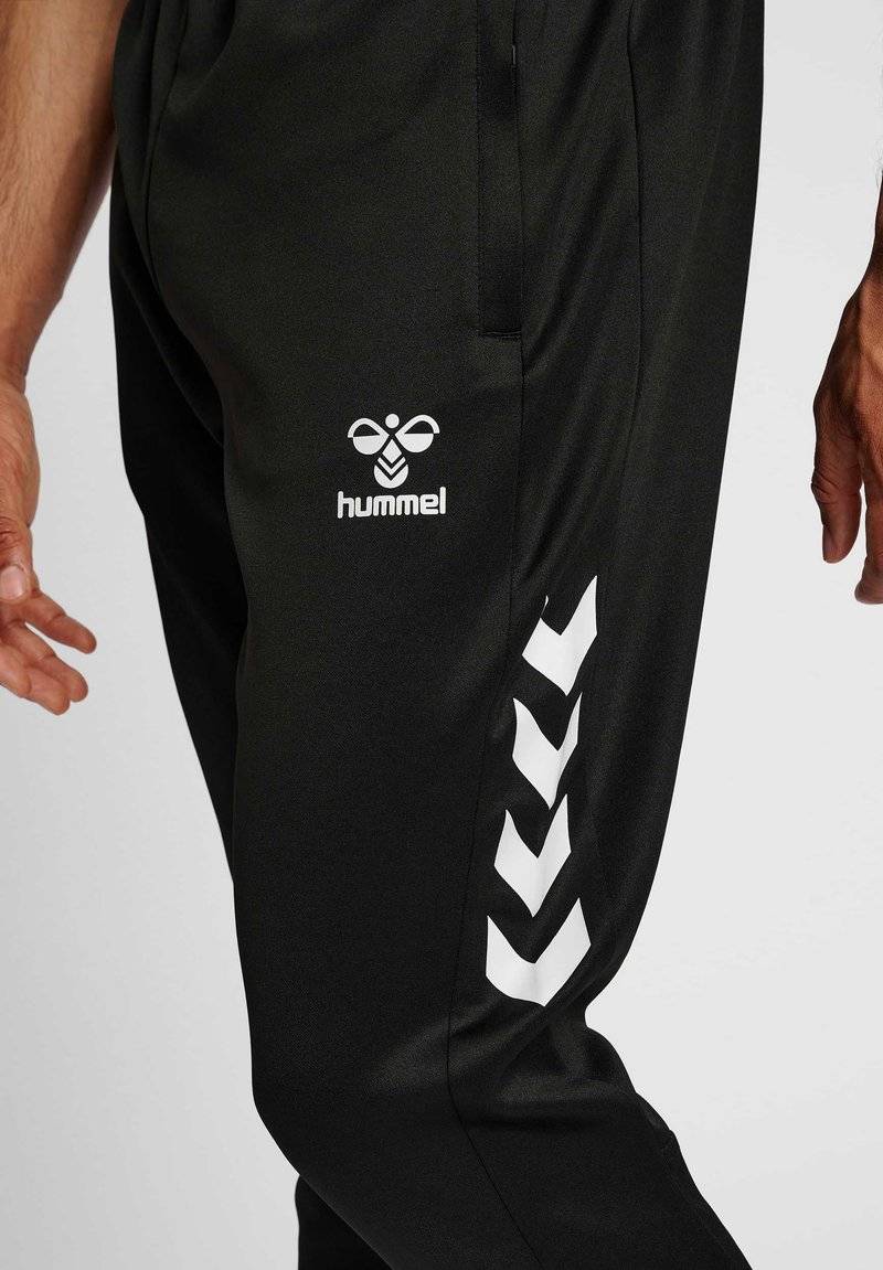 Hummel Hummel CORE XR TRAINING PANTS - Tracksuit bottoms - black Lagerräumung