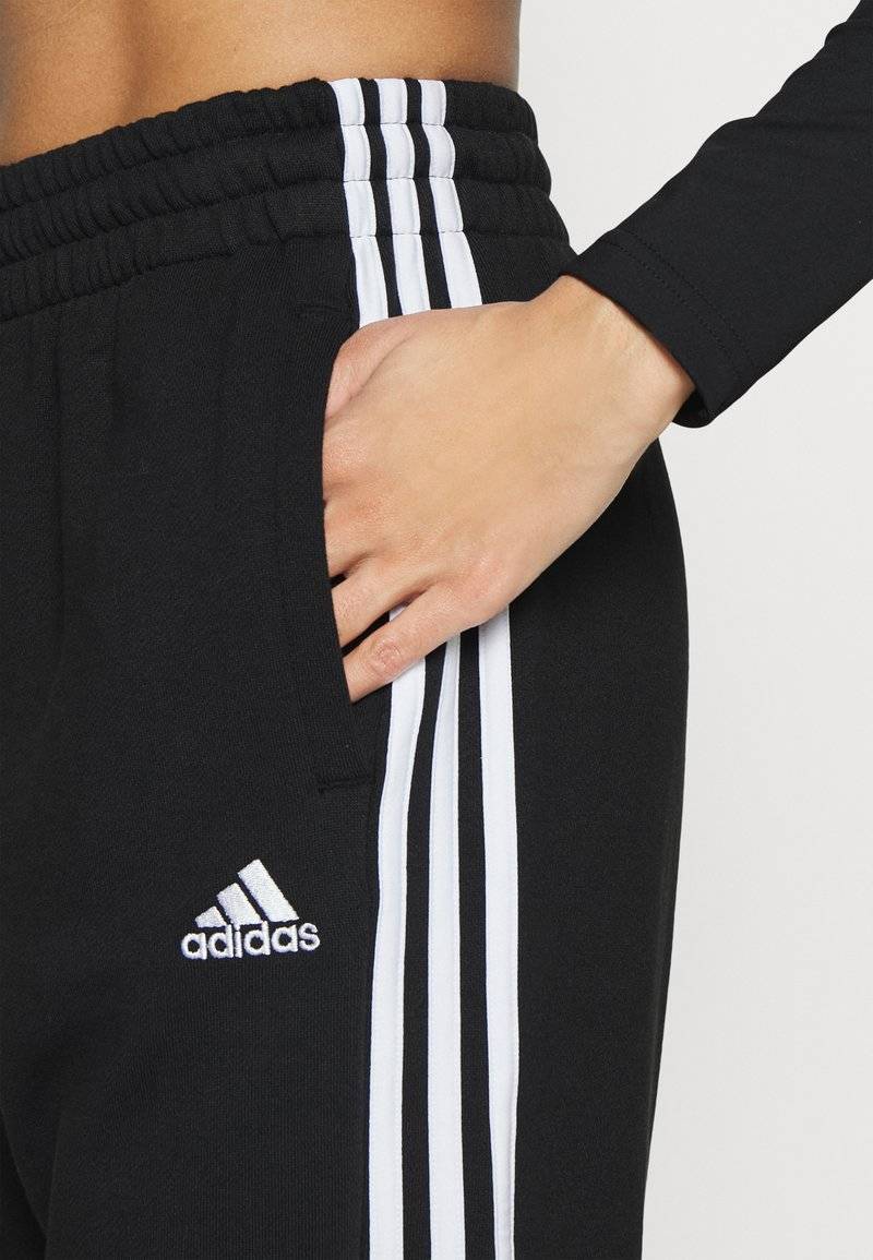 adidas Sportswear adidas Sportswear ESSENTIALS 3-STRIPES LOOSE-FIT - Tracksuit bottoms Räumungsverkauf