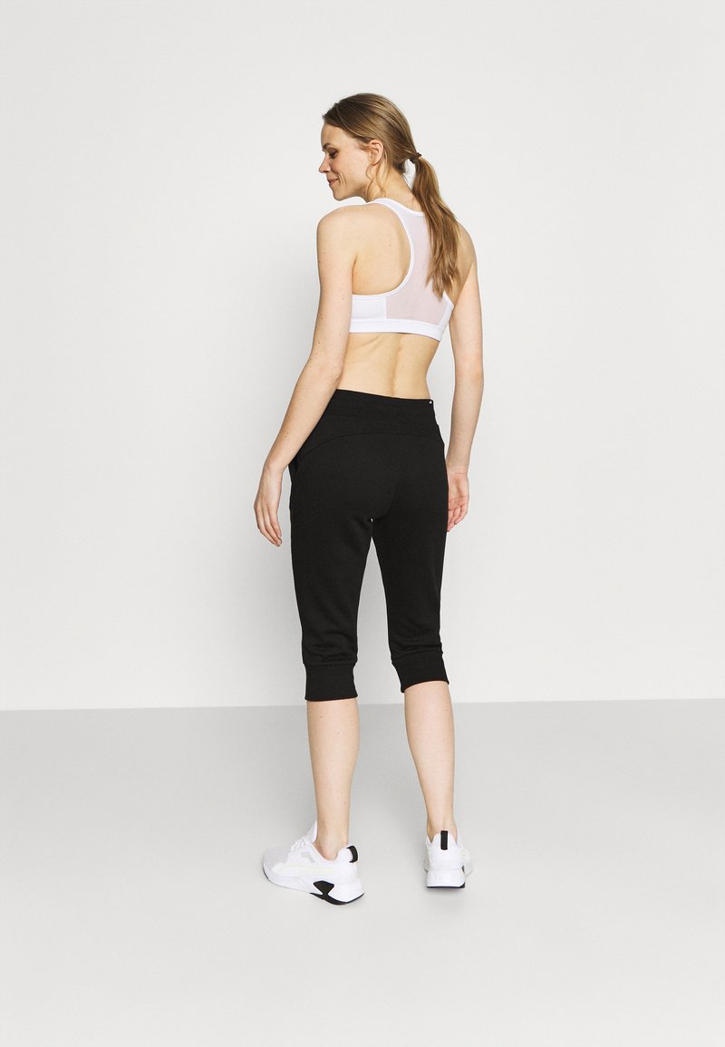 Puma Puma CAPRI - 3/4 sports trousers - black Günstig kaufen