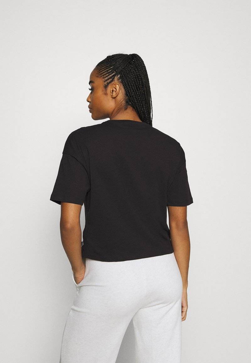 Puma Puma CROPPED LOGO TEE - Print T-shirt - puma black Online Outlet