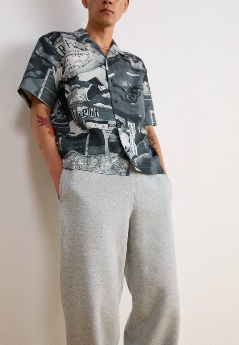 Nike Sportswear Nike Sportswear BUNGIE PANT - Tracksuit bottoms - grey heather Bis zu 55% Rabatt
