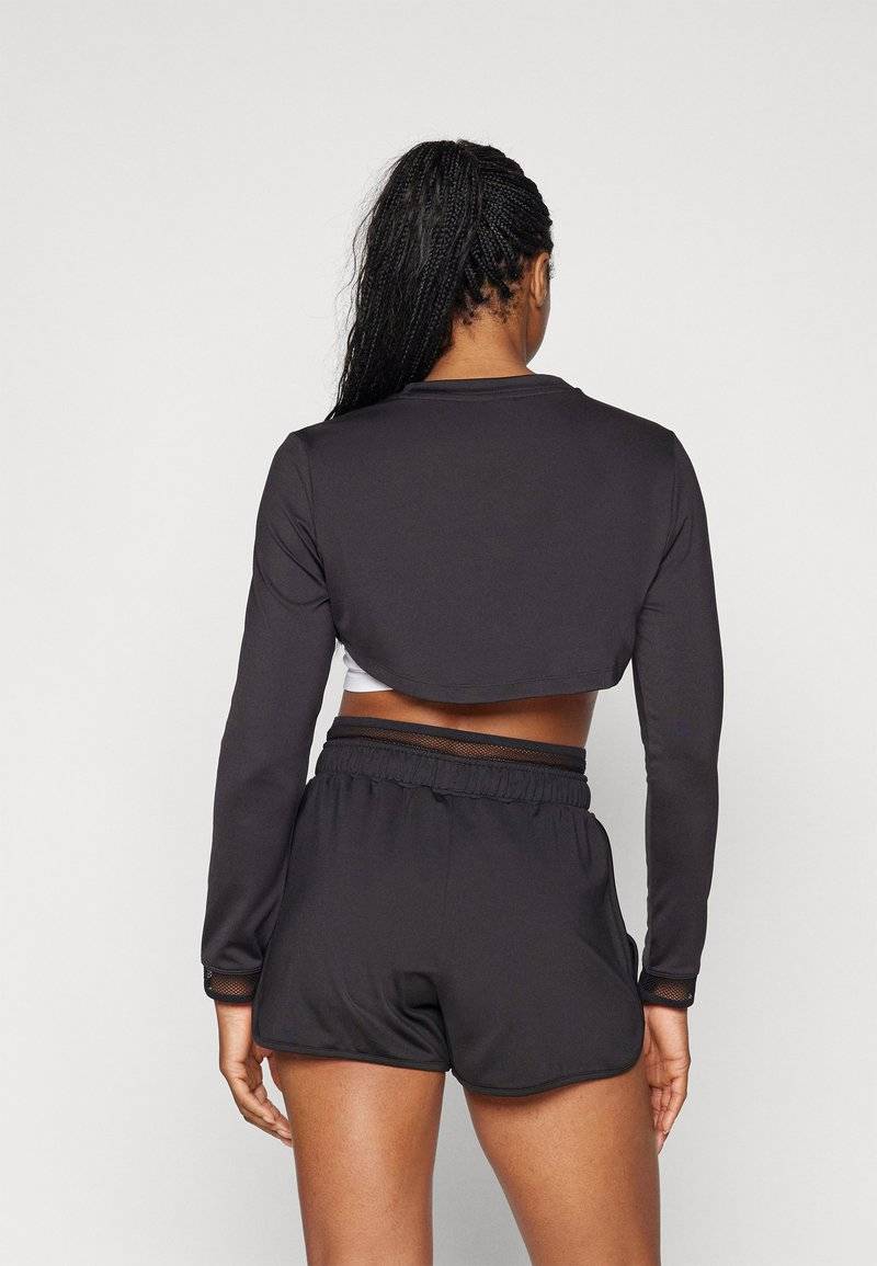Puma Puma PAMELA REIF CROPPED - Long sleeved top - black Black Friday