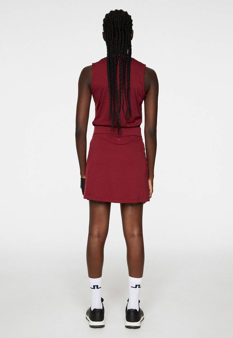 J.LINDEBERG Sports J.LINDEBERG Sports AMELIE MID - Sports skirt - cabernet Letzte 3 Tage
