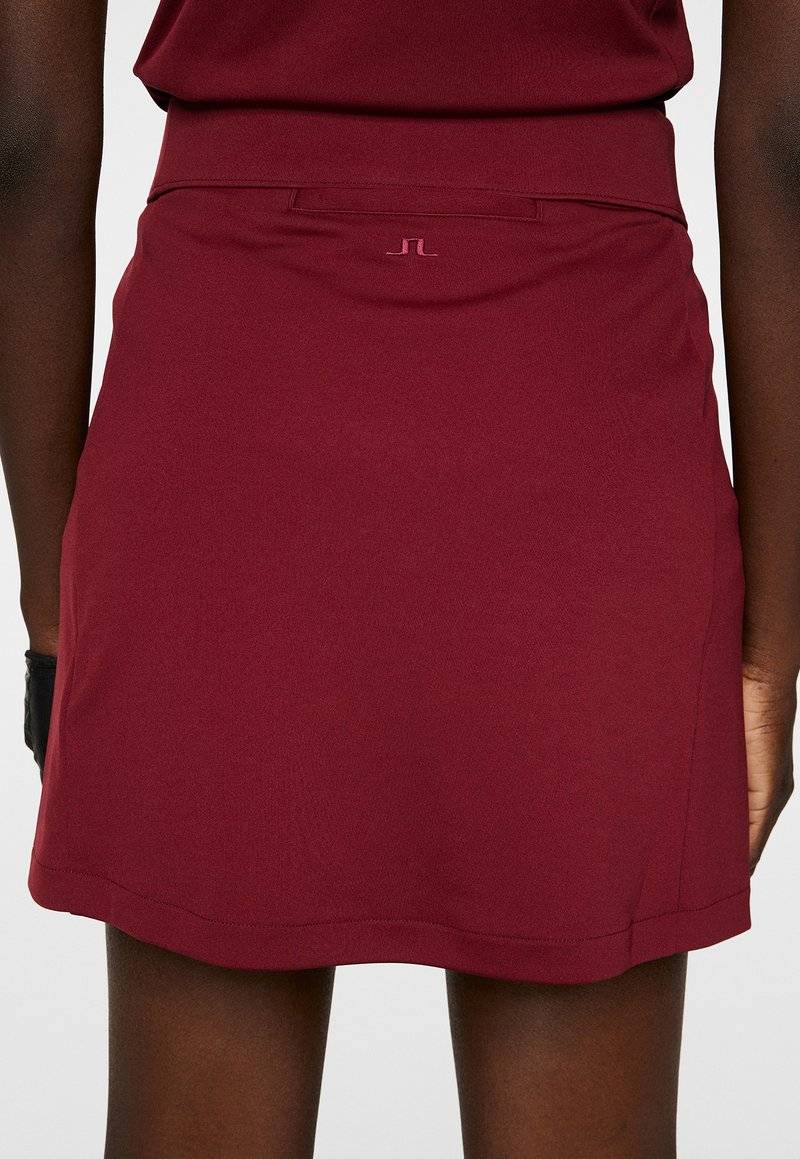 J.LINDEBERG Sports J.LINDEBERG Sports AMELIE MID - Sports skirt - cabernet Letzte 3 Tage