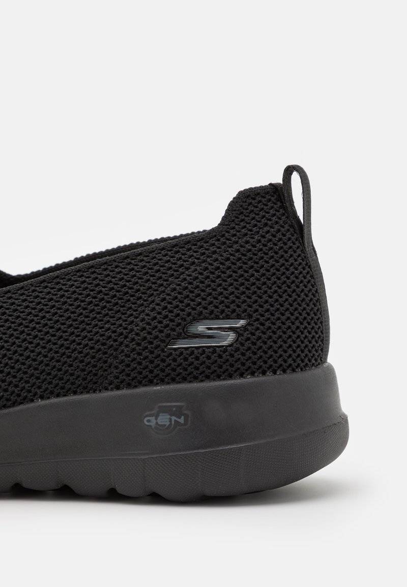 Skechers Performance Skechers Performance GO WALK SLIP ON - Walking trainers - black Bis zu 55% Rabatt