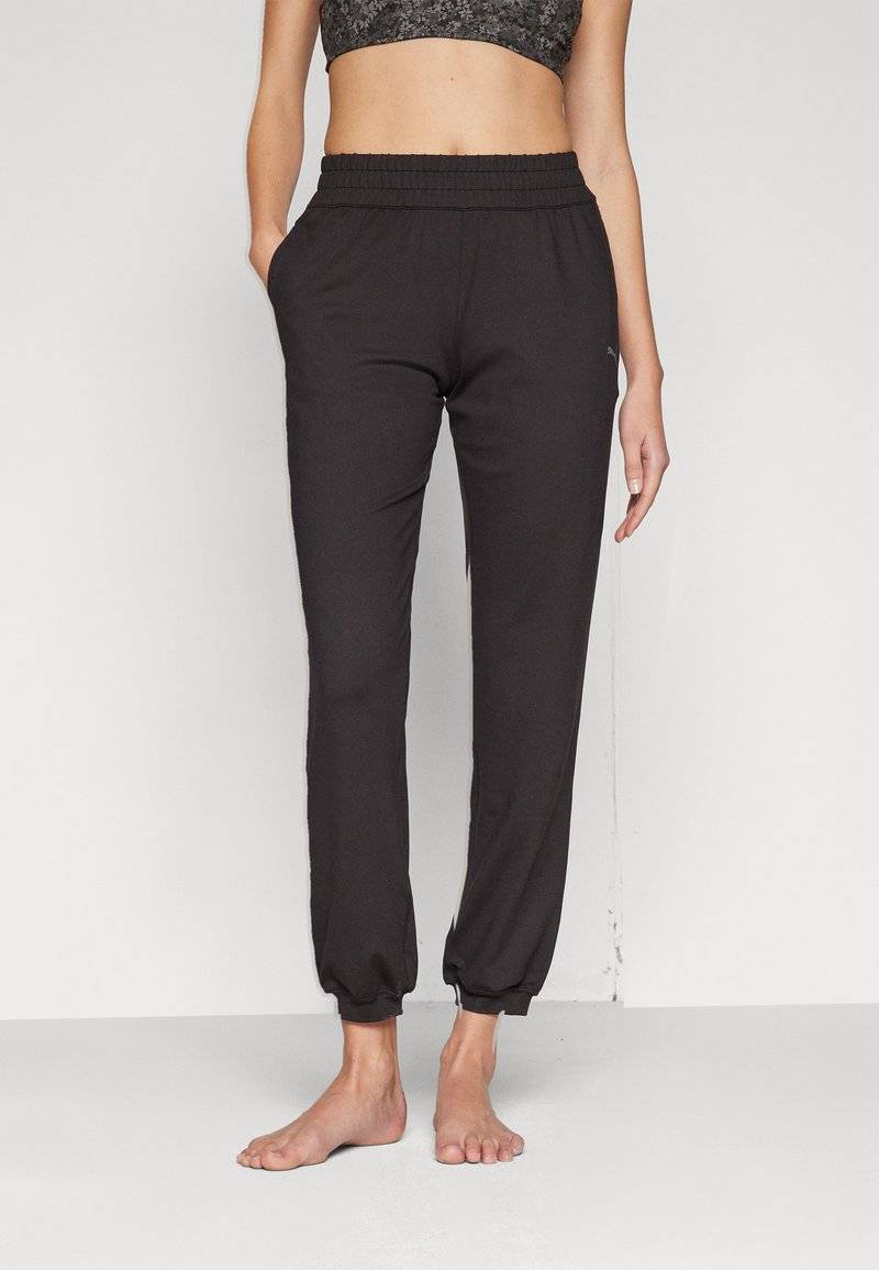 Puma Puma STUDIO FOUNDATIONS - Tracksuit bottoms - black Muttertagsangebot