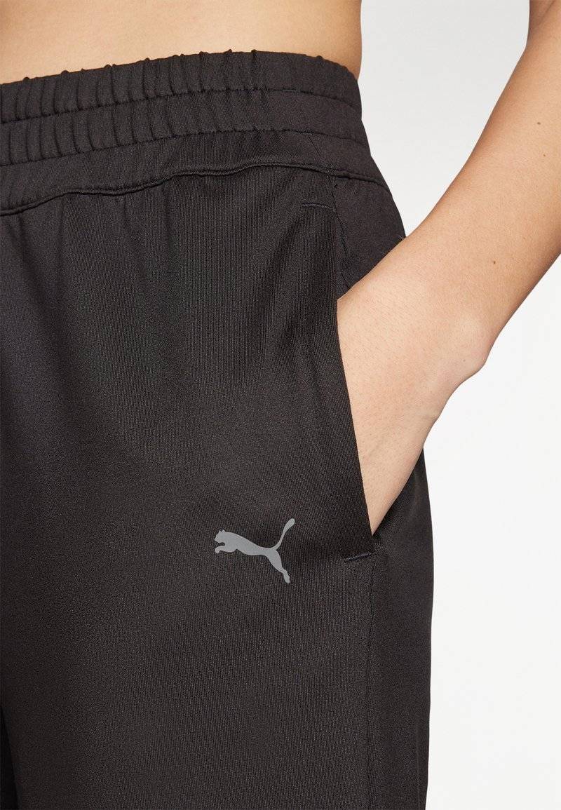 Puma Puma STUDIO FOUNDATIONS - Tracksuit bottoms - black Muttertagsangebot