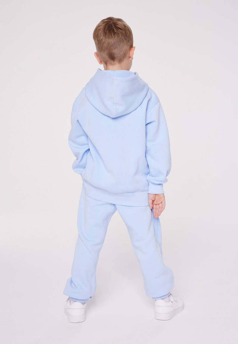 Champion Champion EXCLUSIVE PANT UNISEX - Tracksuit bottoms - light blue Bis zu 60% Rabatt