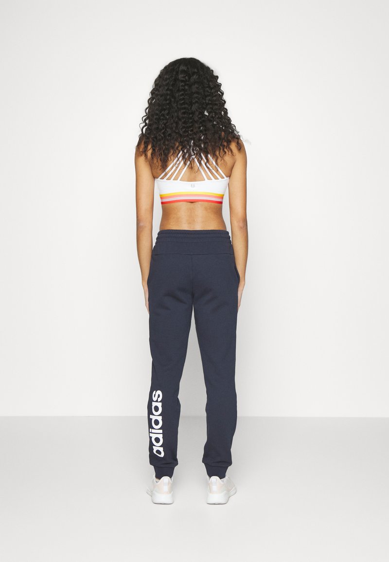 adidas Sportswear adidas Sportswear ESSENTIALS LINEAR CUFFED - Tracksuit bottoms - legend ink Rabatte dieses Monats