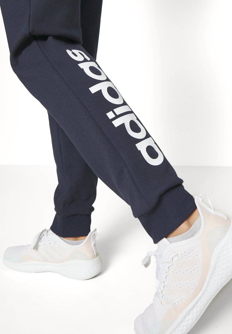adidas Sportswear adidas Sportswear ESSENTIALS LINEAR CUFFED - Tracksuit bottoms - legend ink Rabatte dieses Monats