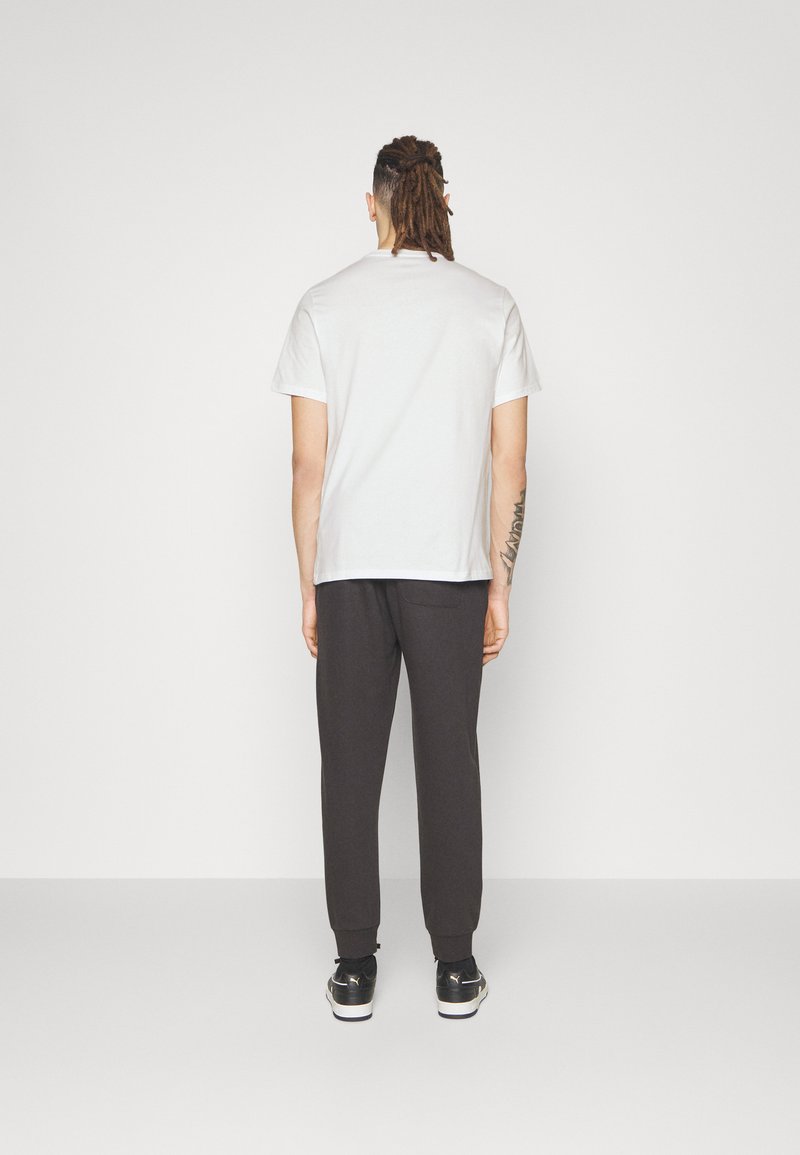 Converse Converse GO TO STAR CHEVRON TEE UNISEX - Print T-shirt - white Fabrikverkauf