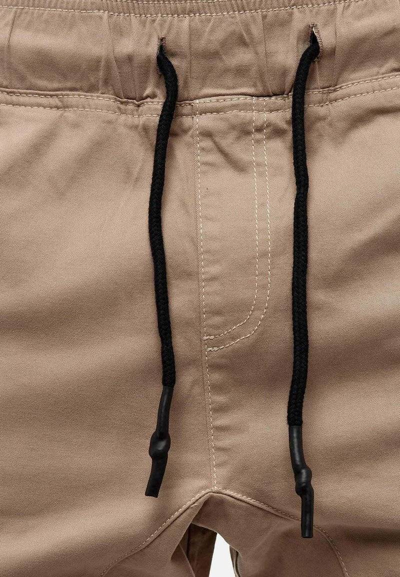 Tazzio Tazzio Cargo trousers - beige Schlussverkauf